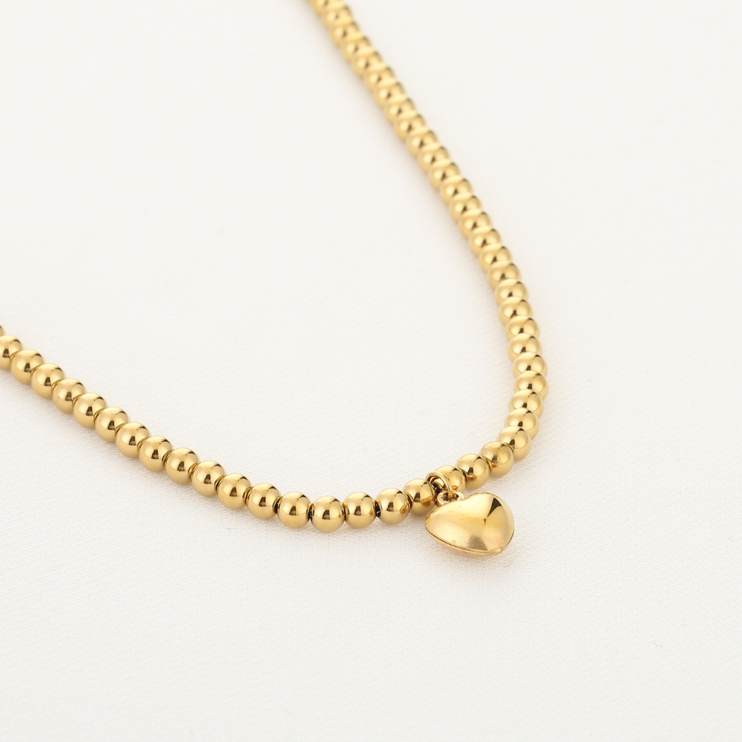 Bolletjes ketting met hart bedel