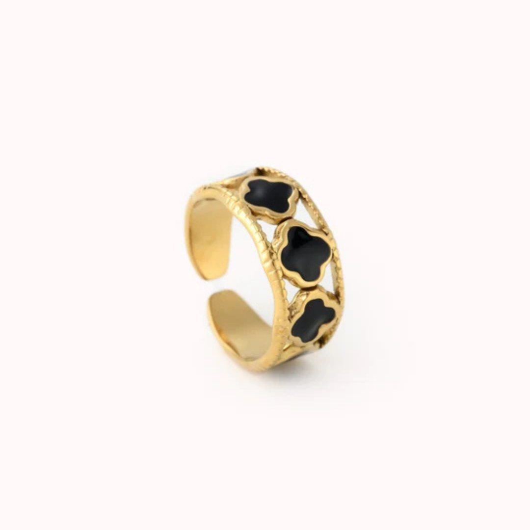 Goudkleurige ring met zwarte klavertjes