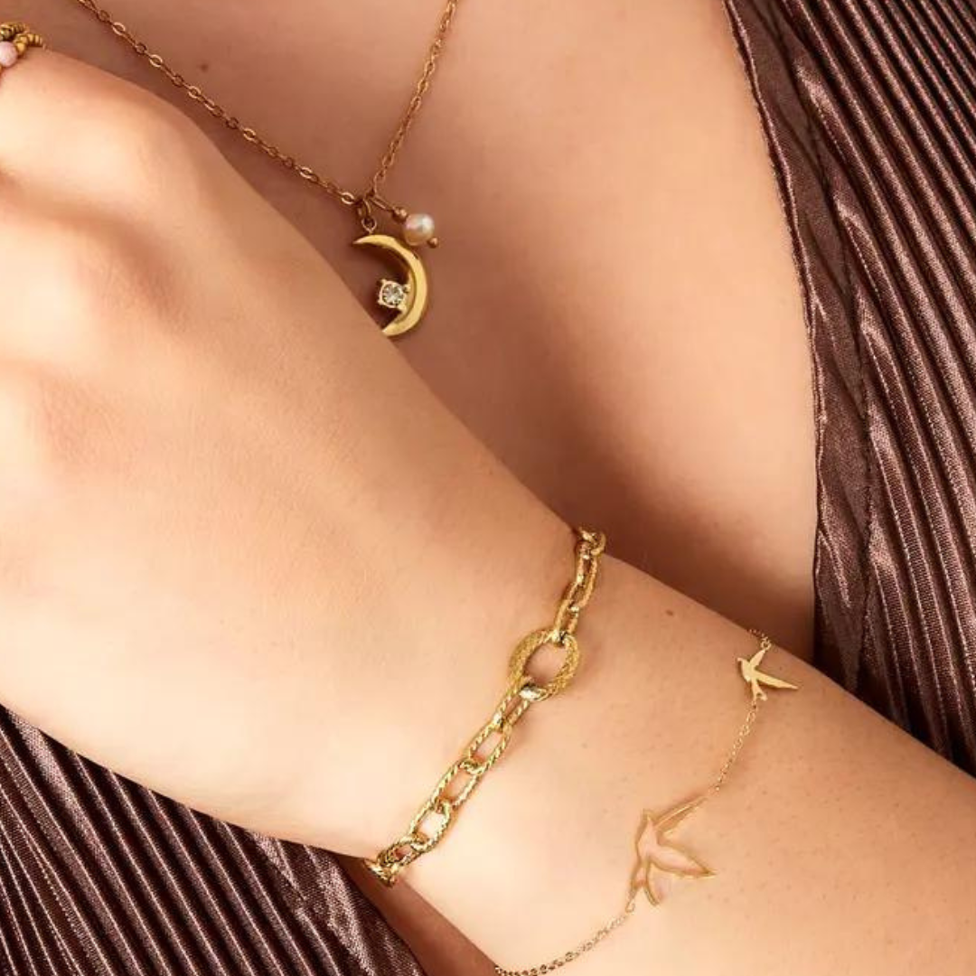 Schakelarmband grof goud